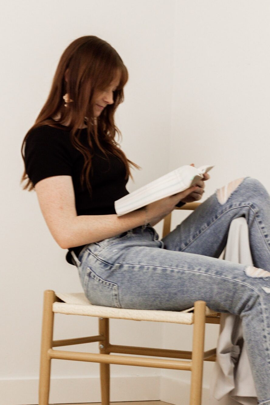 This is an image of your inner work coach, Carly, reading her Bible.
