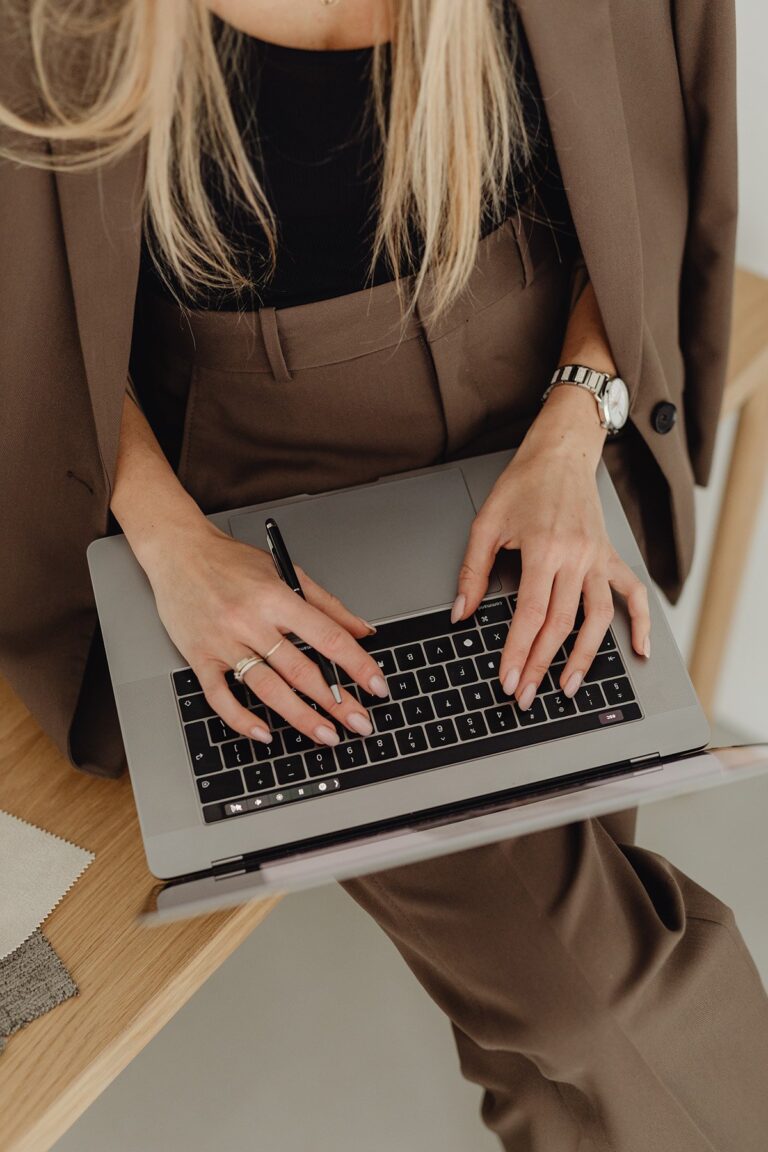 A Christian Woman using a laptop to honor God.
