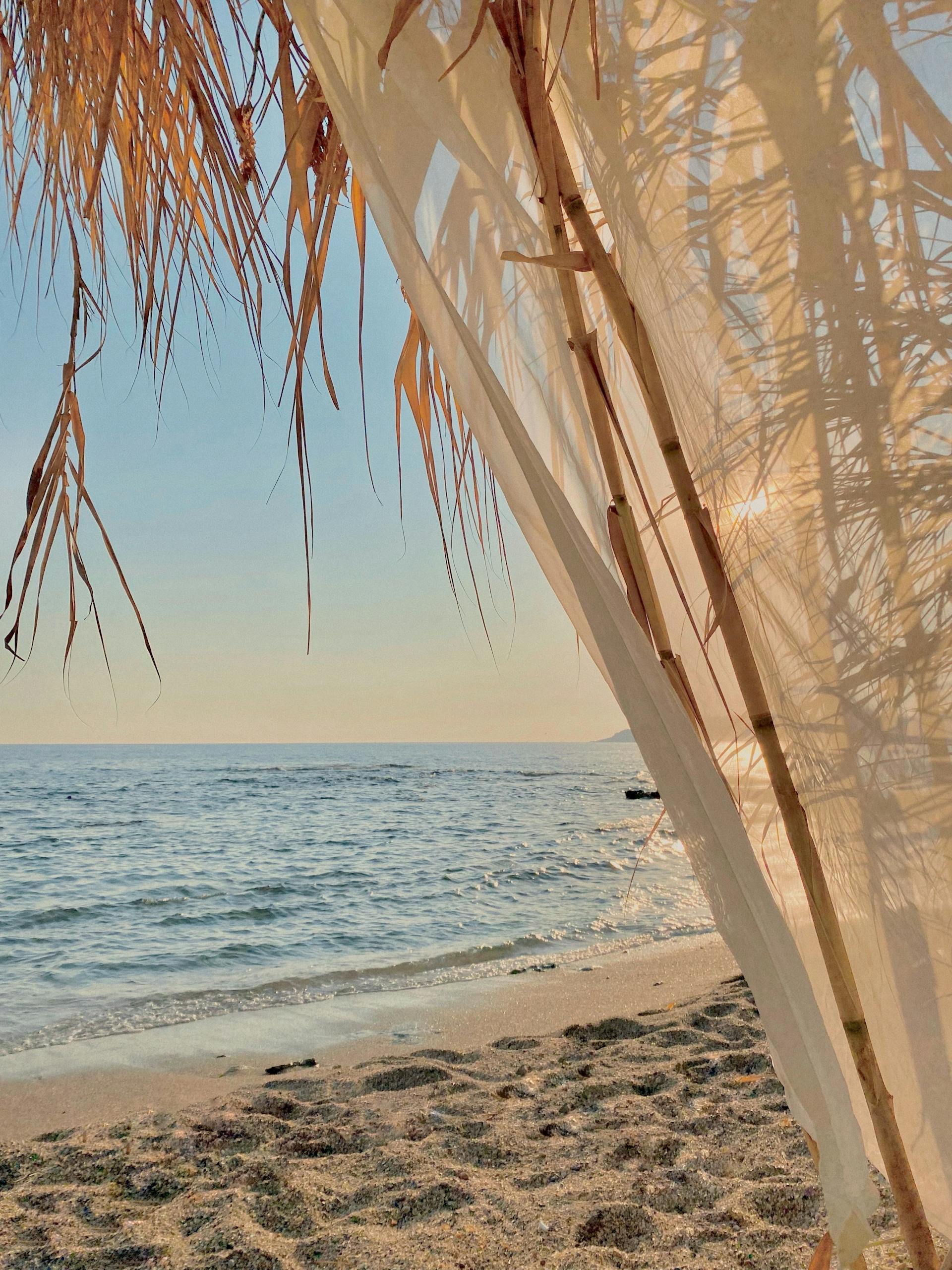 Relaxing beach view with a canopy on a sunny day in Turkey. Ideal for travel and lifestyle imagery.