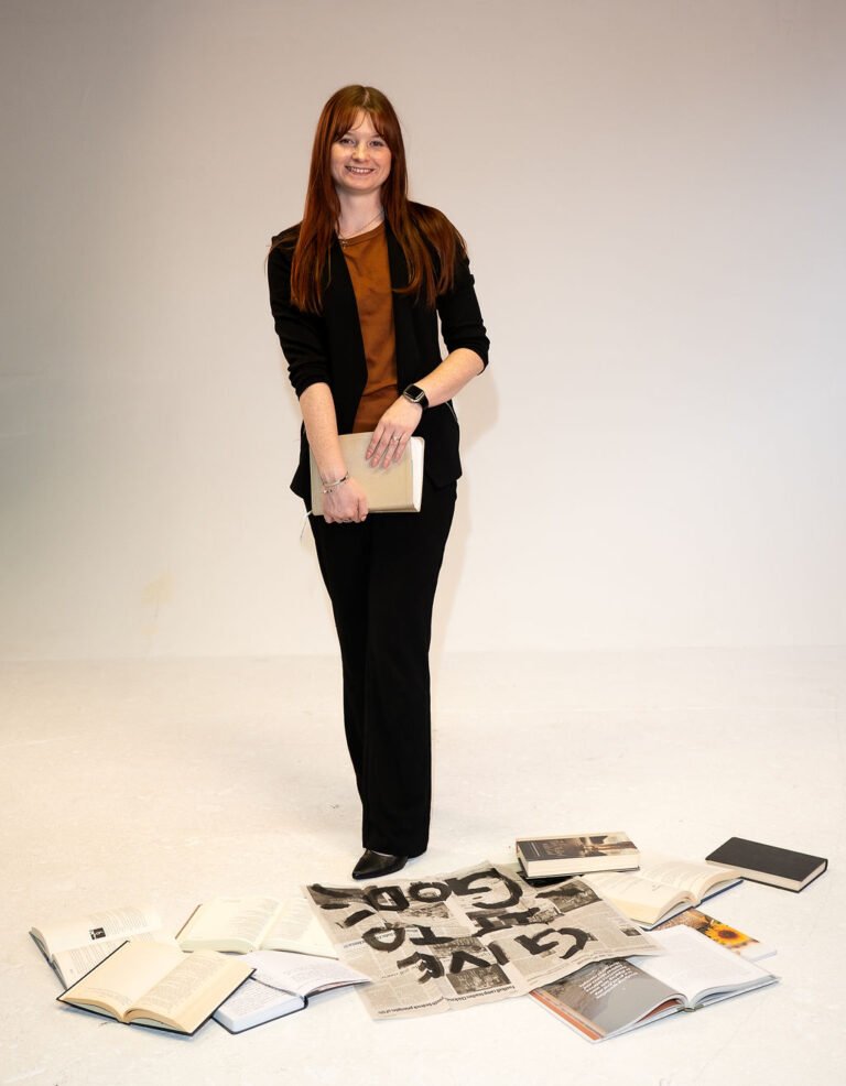 Carly standing and Holding her Bible