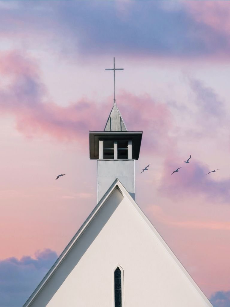 A beautiful church steeple against a sunrise sky, complemented by flying birds and pastel clouds, used for post regarding Christian conviction.